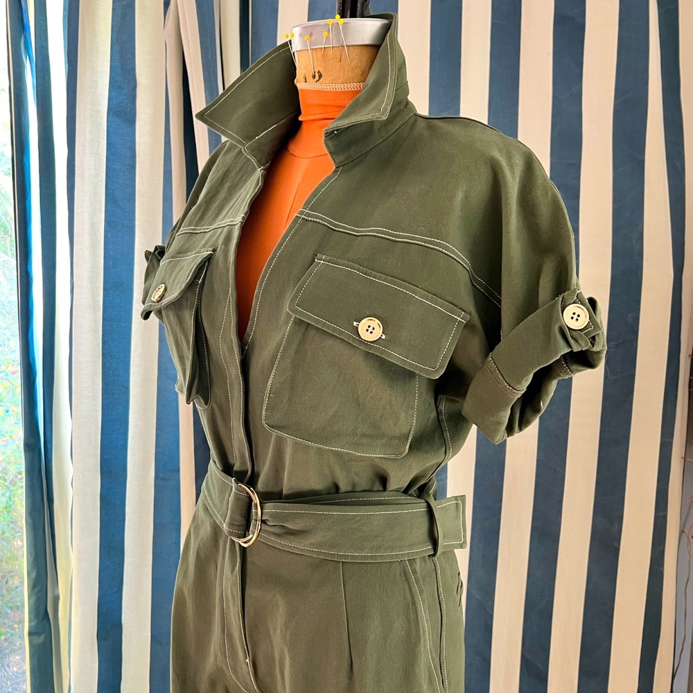 Olive green cotton jumpsuit with gold accents